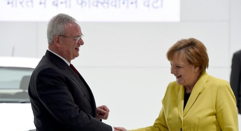 German lawmakers will be asking Chancellor Angela Merkel, pictured here with Volkswagen's then-CEO Martin Winterkorn in April 2015, about the extent of her government's support for the carmaker