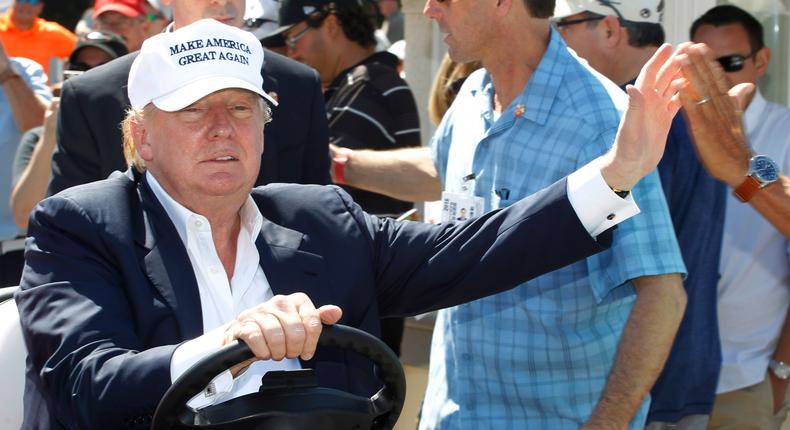 Republican presidential candidate Donald Trump drives himself to the golf course to watch the final round of the Cadillac Championship golf tournament, Sunday, March 6, 2016, in Doral, Fla.