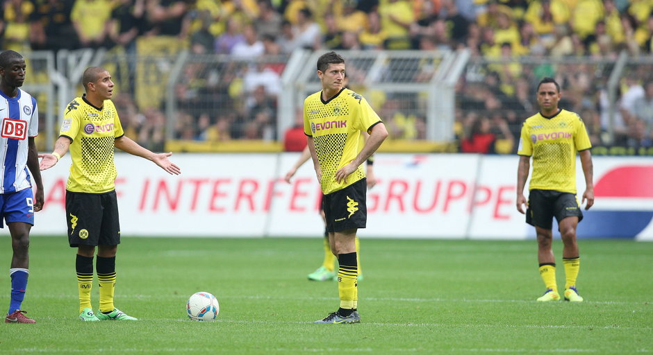 Mohamed Zidan (z lewej) i Robert Lewandowski