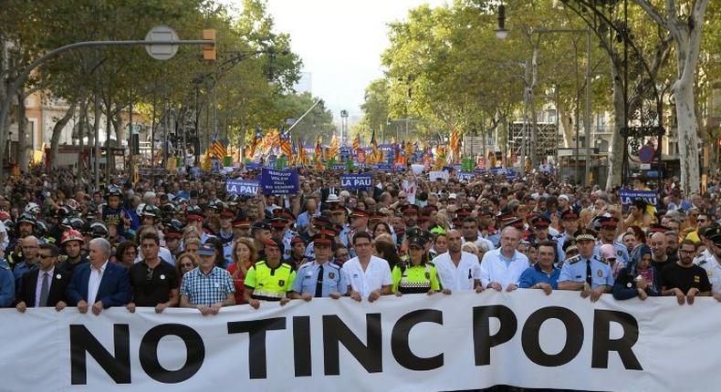 Tens of thousands marched in Barcelona on Saturday to commemorate the two deadly attacks in Catalonia, including Spain's King Felipe VI