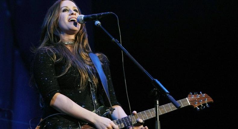 The manager of Alanis Morissette has admitted in court in Los Angeles to stealing $5 million from the singer and songwriter's account