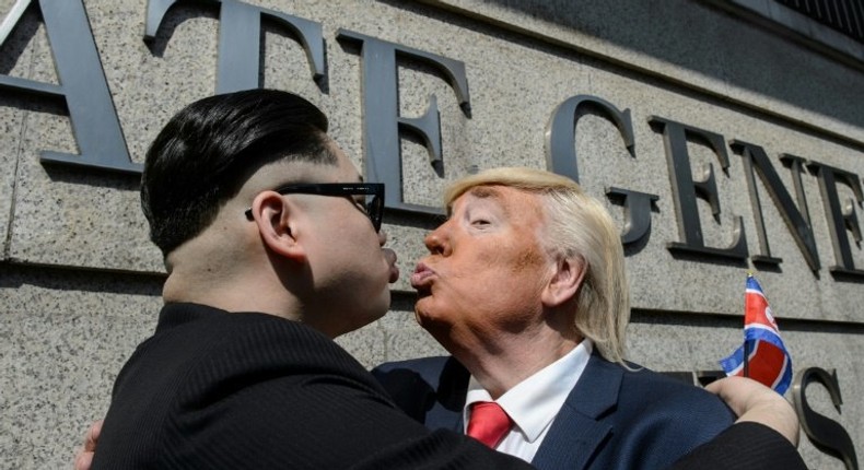 Impersonators of North Korean leader Kim Jong-Un and US President Donald Trump pose outside the US consulate in Hong Kong on January 25, 2017