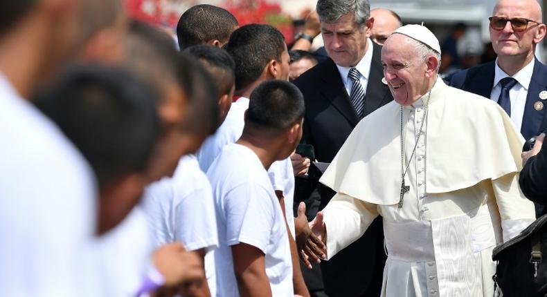 Pope Francis (R) greets young detainees before leaving Las Garzas youth detention centre in Pacora, on the outskirts of Panama City, on January 25, 2019, during his visit to Panama for World Youth Day