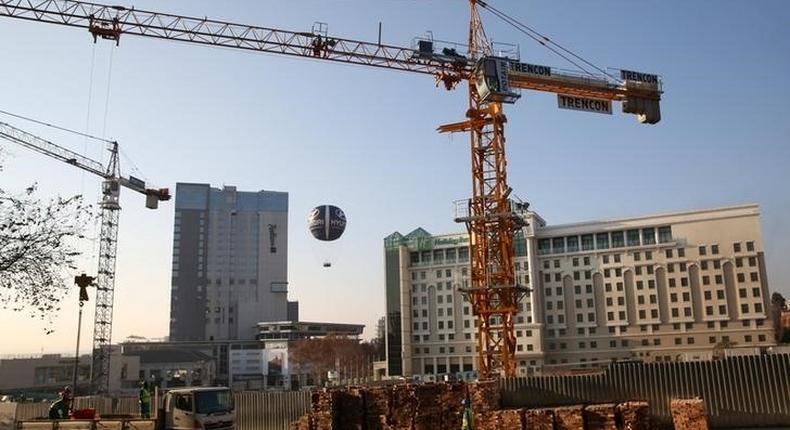 Cranes are seen at a construction site in Sandton outside Johannesburg