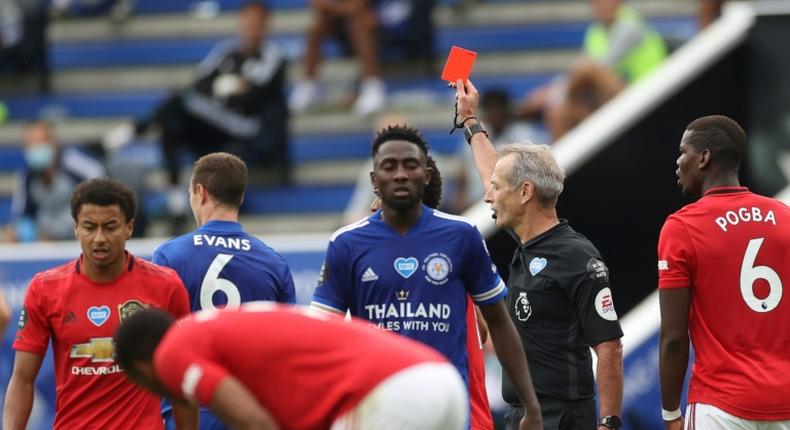 Footballers risk being sent off if a referee considers they coughed deliberately at an opponent or a match official under new guidelines from rule makers IFAB