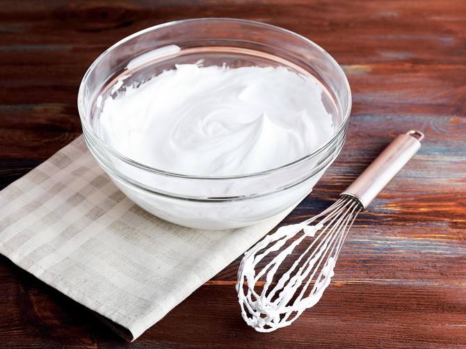 106472_stockphotowhippedeggwhitesforcreamonwoodenbackground273366260