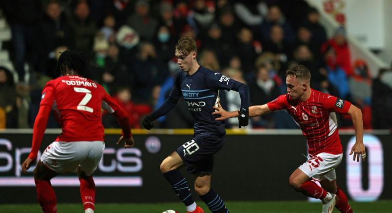 Rising star: Cole Palmer (centre) shone in Manchester City's 4-1 win at Swindon Creator: Adrian DENNIS