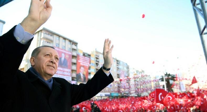 This handout picture released by the Turkish Presidential Press Service on February 17, 2017 shows Turkish President Recep Tayyip Erdogan greeting the audience during a rally