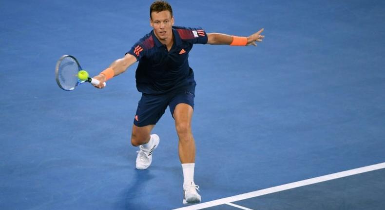 Czech Republic's Tomas Berdych hits a return against Switzerland's Roger Federer during their men's singles third round match on day five of the Australian Open tennis tournament in Melbourne on January 20, 2017