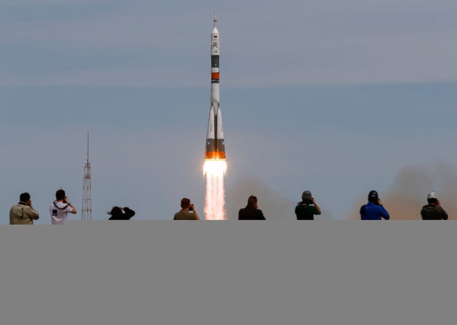 Photographers take pictures as Soyuz MS-04 spacecraft carrying the crew of Fischer of the U.S. and Yurchikhin of Russia as it blasts off to ISS from the launchpad at the Baikonur Cosmodrome