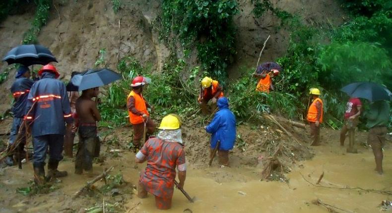 Firefighters search for bodies after landslides that have left at least 146 people dead