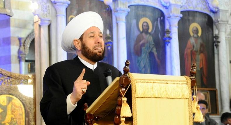 Syrian Grand Mufti Ahmed Badreddin Hassoun speaks during Christmas mass at the Cathedral of Mary in Damascus on December 25, 2013, in a picture released by the official Syrian Arab News Agency (SANA)