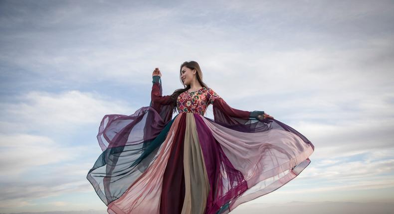Ayeda Shadab does a photo shoot at a scenic overlook in Herat, Afghanistan.
