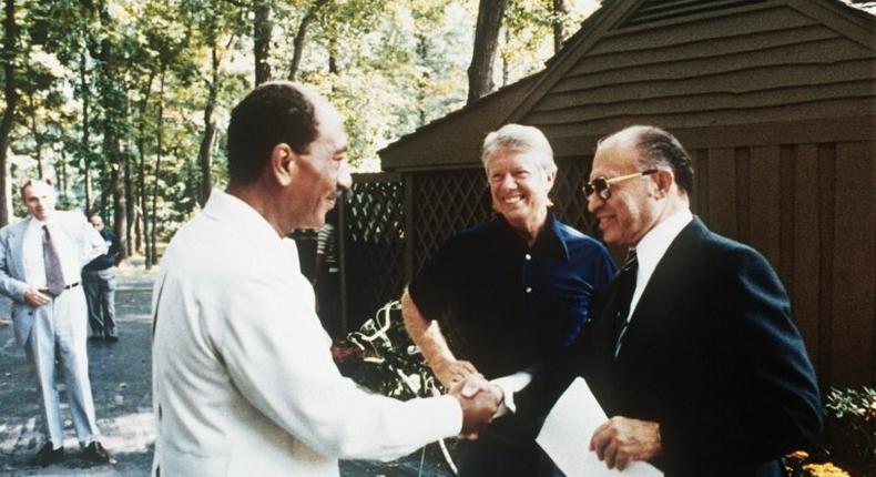 Jimmy Carter with Egypt's Anwar Sadat (left) and Israel's Menachem Begin (right) on September 6, 1978 at Camp David