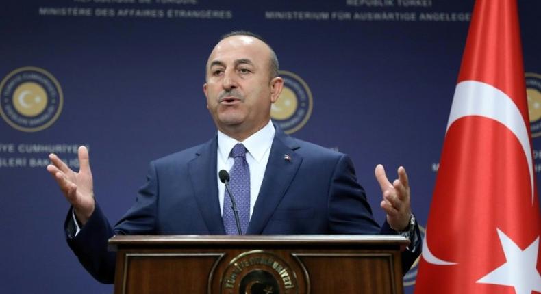 Turkish Foreign Minister Mevlut Cavusoglu said Athens and the Greek Cypriot side had to wake up from the notion that Ankara would withdraw its troops