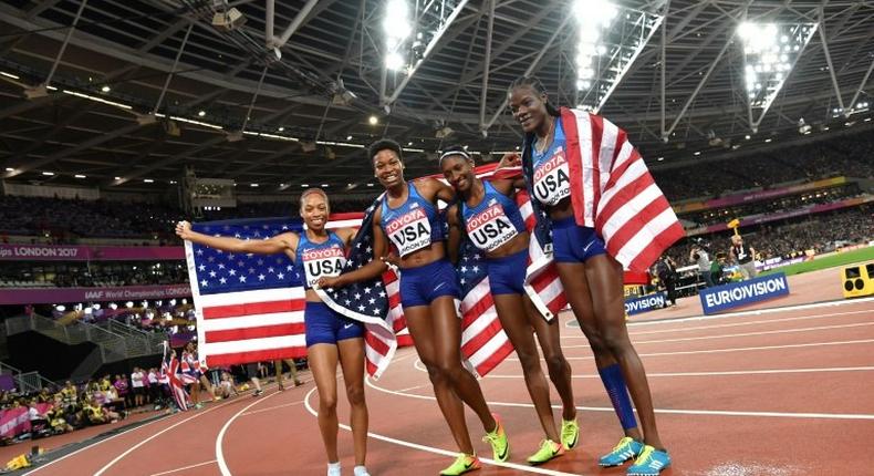 US athletes Quanera Hayes, Allyson Felix, Shakima Wimbley and Phyllis Francis celebrate winning the final of the women's 4x400m relay athletics event at the 2017 IAAF World Championships at the London Stadium in London on August 13, 2017