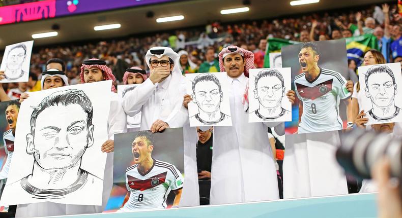 Qatar fans, protest with photos of former Germany player Mesut Ozil, during the match between Spain and Germany, for the 2nd round of Group E of the FIFA World Cup on November 27, 2022.