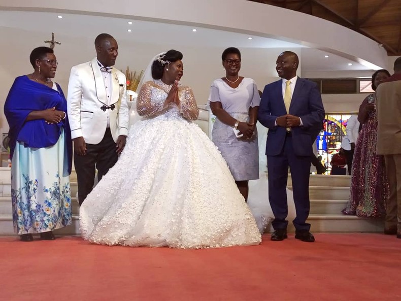 Junior Trade Minister David Bahati with the newlyweds at the Munyonyo church