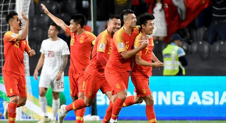 Lei Wu celebreates scoring one of his two goals in China's Asian Cup win over the Philippines