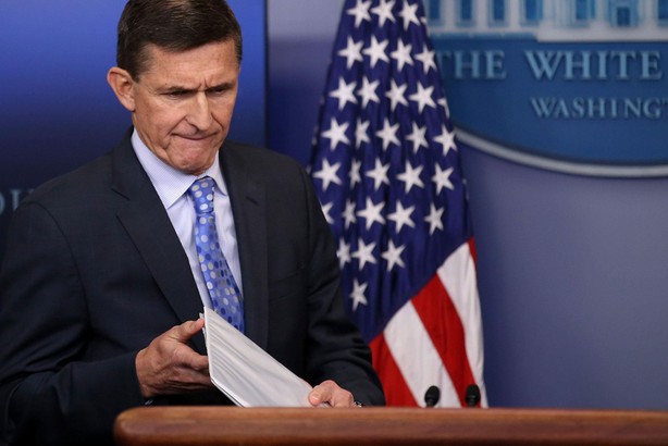 National security adviser General Michael Flynn (L) arrives to deliver a statement next to Press Sec