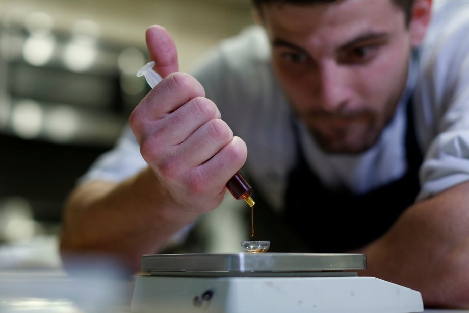 Chef Christopher Sayegh weighs a marijuana extract oil in his kitchen in Los Angeles, California.