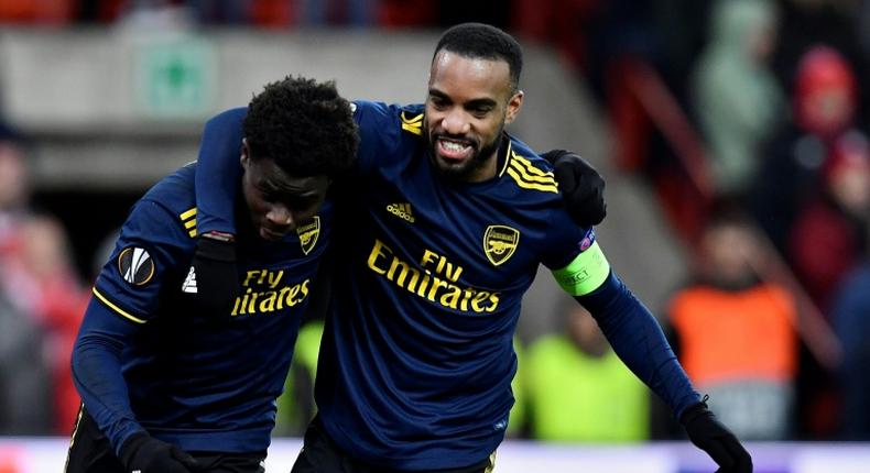 Double act: Bukayo Saka celebrates with Alexandre Lacazette