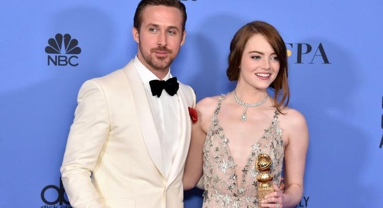 Actor Ryan Gosling (L) and actress Emma Stone pose in the press room during the 74th Annual Golden Globe Awards, at The Beverly Hilton Hotel in Beverly Hills, California, on January 8, 2017