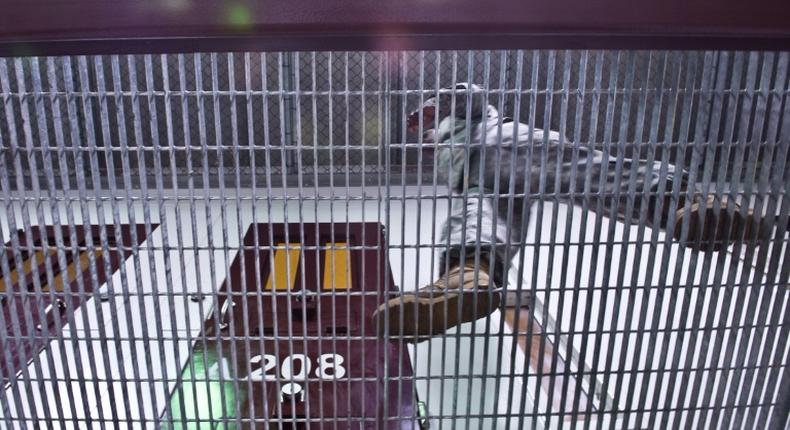 A US Army soldier walking in a detainee facility at the  US Navy's Guantanamo Bay base