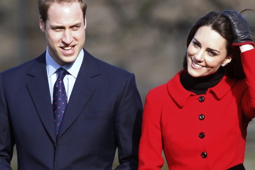 Britain's Prince William and his fiancee Kate Middleton smile during a visit to St. Andrews Universi