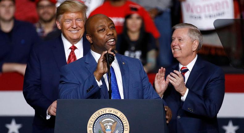 Sen. Tim Scott of South Carolina, center, speaks in front of then-President Donald Trump, left, and Sen. Lindsey Graham of South Carolina during a campaign rally in North Charleston, S.C., on February 28, 2020.AP Photo/Patrick Semansky, File