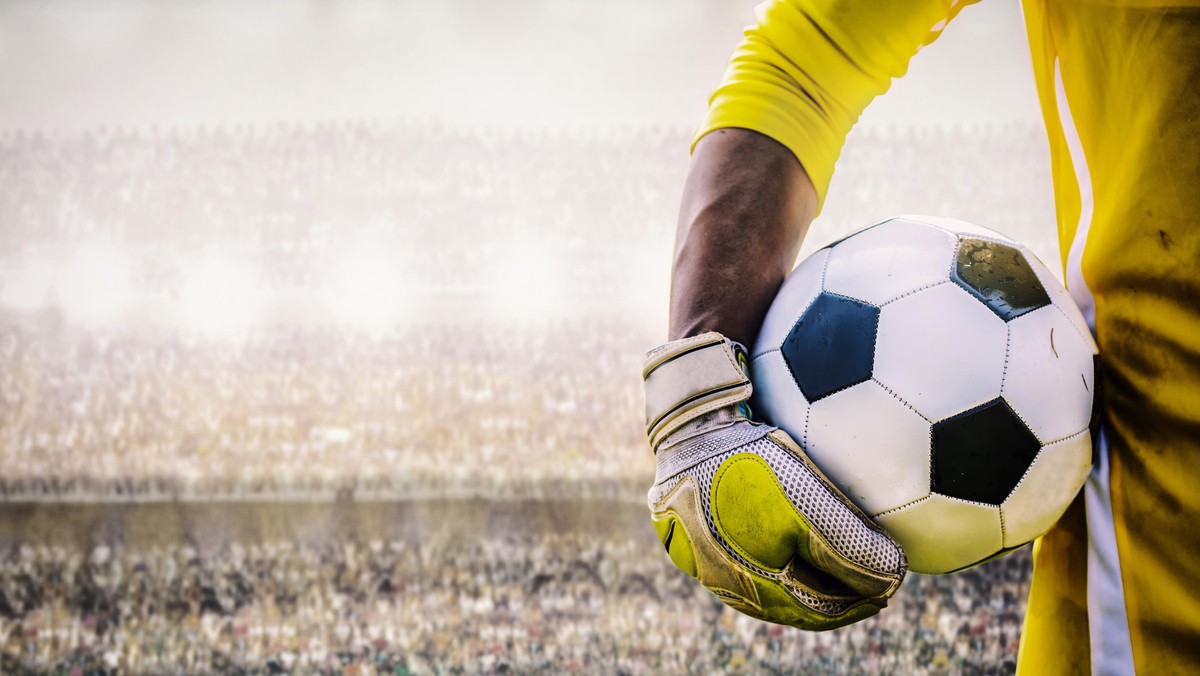 goalkeeper with a soccer ball in the stadium