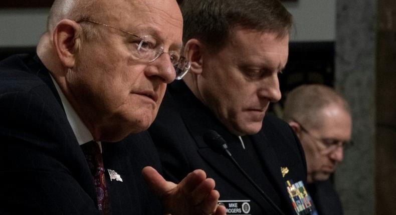 Director of National Intelligence James Clapper (L) and National Security Agency Director Admiral Michael Rogers (C) testify before the Senate Armed Services Committee