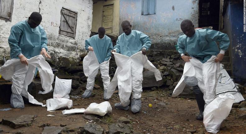 Medics gear up before interacting with Ebola patients in a West African State (CNN)