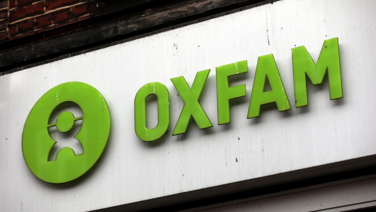 A sign is seen above a branch of Oxfam, in central London