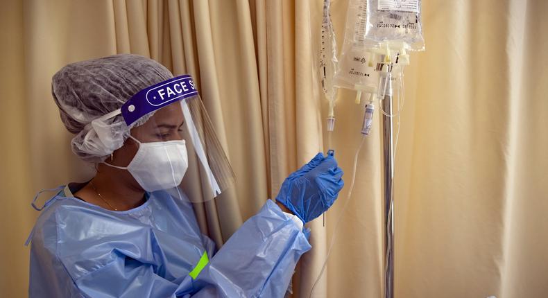 A health workers is seen as Israelis receive the third doses of coronavirus (Covid-19) vaccines at Shaare Zedek Medical Center in West Jerusalem on September 03, 2021.
