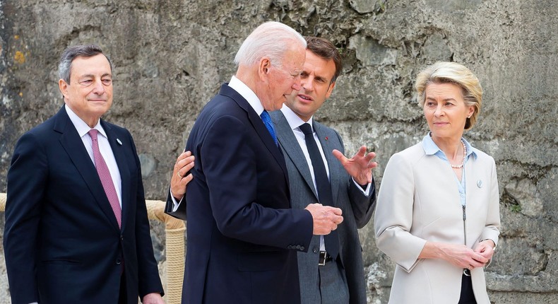 US President Joe Biden and France's President Emmanuel Macron speak as President of the European Commission Ursula von der Leyen and Italy's Prime minister Mario Draghi look on after the family photo at the start of the G7 summit in Carbis Bay, Cornwall on June 11, 2021.
