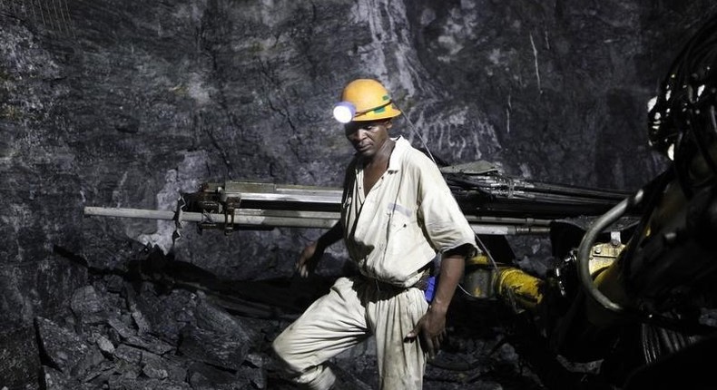 A mine worker is seen underground in South Deep mine outside Johannesburg June 4,2010. REUTERS/Siphiwe Sibeko