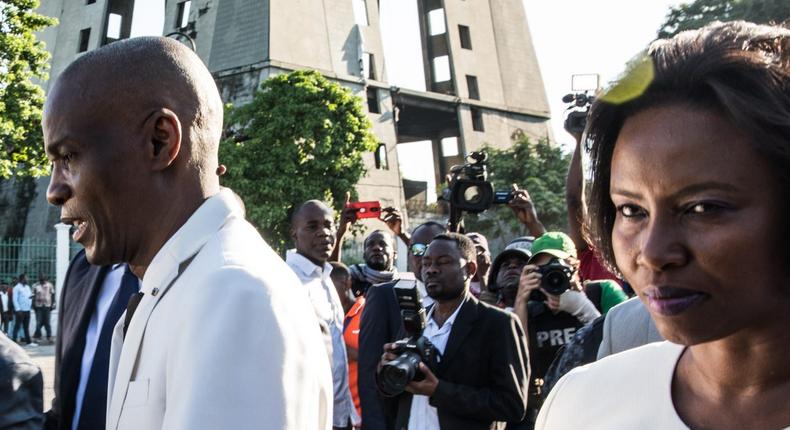 President Jovenel Moises, with his wife Martine tienne Joseph, leaves a ceremony marking the the assassination of Jean-Jacques Dessalines, leader of the Haitian Revolution and the first ruler of an independent Haiti, Port-au-Prince on October 17, 2019.
