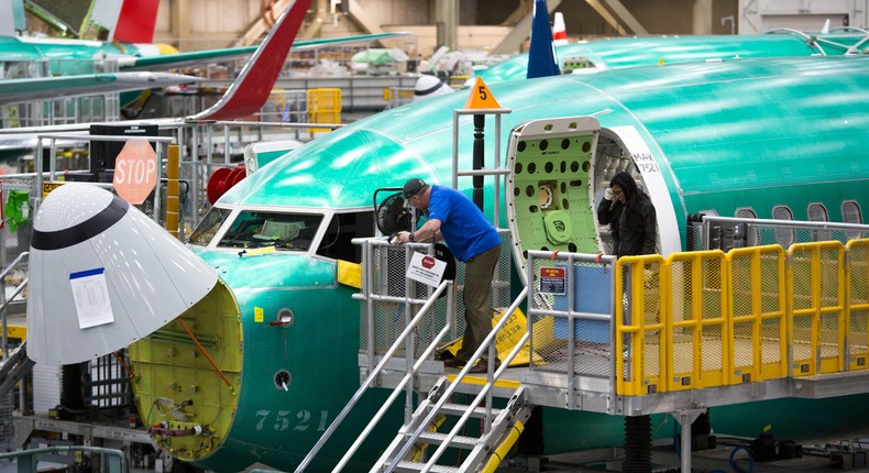 Employees working on a Boeing 737 Max at the factory in Renton, Washington.JASON REDMOND/AFP via Getty Images