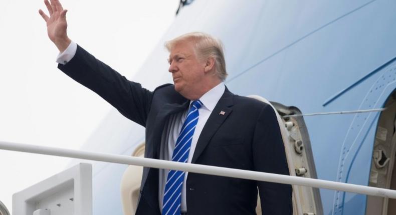 US President Donald Trump boards Air Force One prior to departure from Andrews Air Force Base in Maryland, July 5, 2017, as he travels on a 4-day trip to Poland and Germany