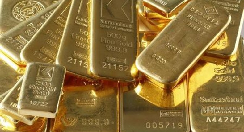 Gold hovers near 3-week high as equities slip