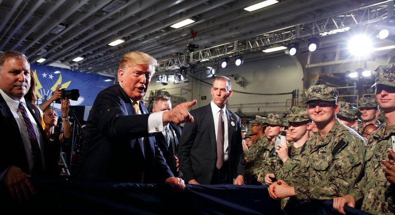 President Donald Trump talks with troops at a Memorial Day event aboard the USS Wasp amphibious assault ship, Tuesday, May 28, 2019, in Yokosuka, Japan.