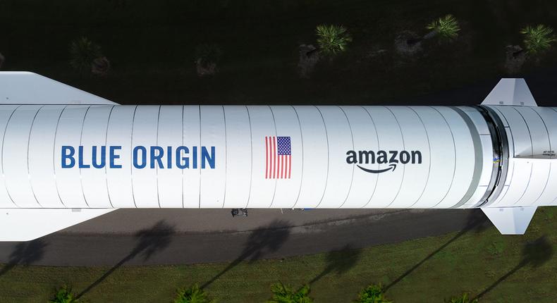 Overhead of the New Glenn rocket from Blue Origin, one of the three heavy-lift launch providers Amazon selected for Project Kuiper (featuring a mock-up of the Amazon logo).