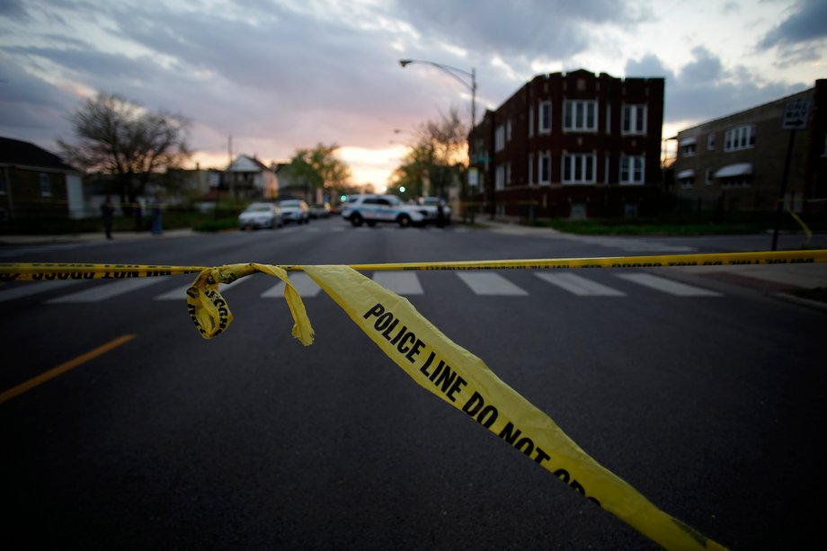 Police crime tape displayed at the scene where a 16-year-old boy was fatally shot in the head and another 18-year-old man was wounded by gunfire on the 7300 block of South Sangamon Street on April 25 in Chicago.