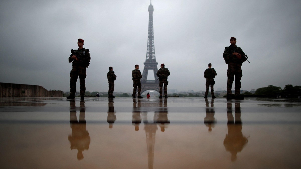 French soldiers patrol near the Eiffel Tower as part of the Sentinelle security plan in Paris