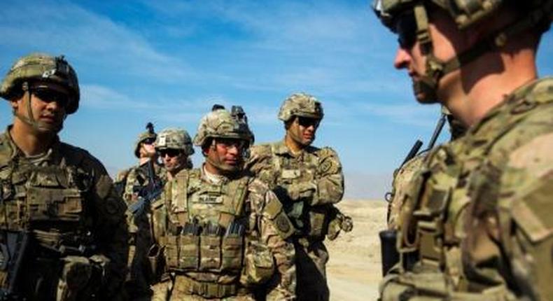 U.S. soldiers from Dragon Troop of the 3rd Cavalry Regiment discuss their mission during their first training exercise of the new year near operating base Gamberi in the Laghman province of Afghanistan January 1, 2015.