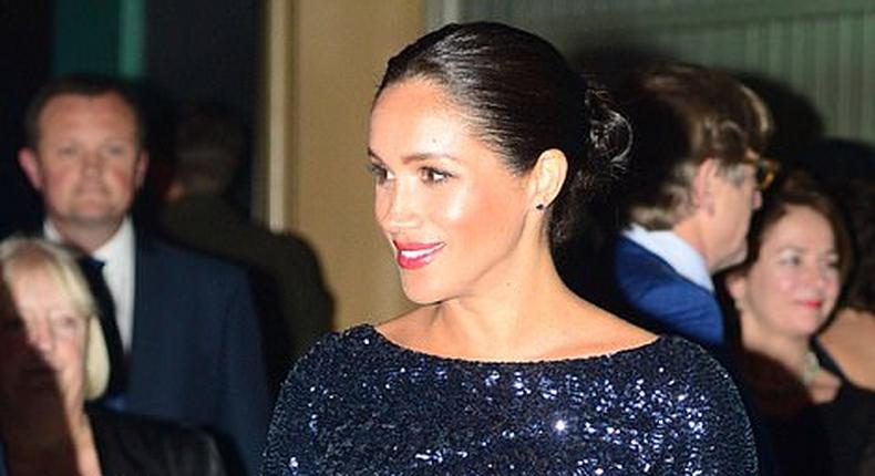 Meghan Markle is all smiles in a sequin Roland Mouret dress for a performance of Cirque du Soelil at the Royal Albert Hall