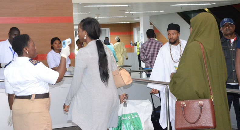 File Photo: Port Health Official screening passengers for Yellow fever at the International Terminal of Nnamdi Azkiwe International Airport in Abuja on Wednesday (30/5/18) /Albert Otu/ICE/NAN