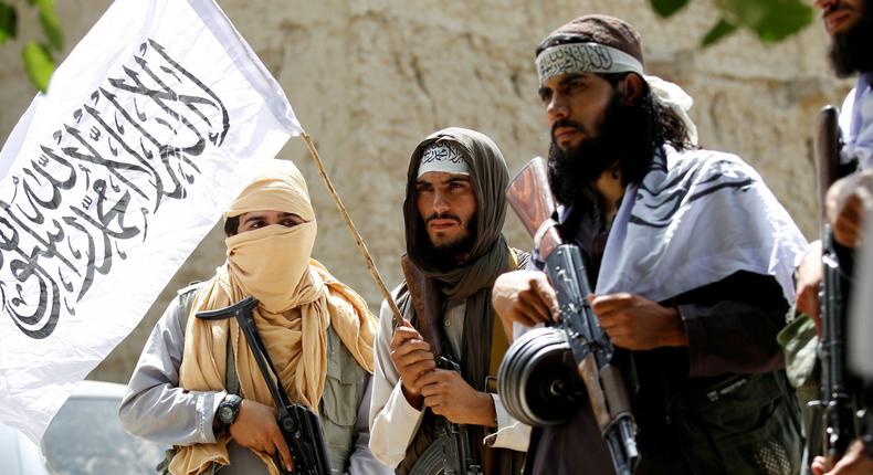 FILE PHOTO: Taliban walk as they celebrate ceasefire in Ghanikhel district of Nangarhar province, Afghanistan June 16, 2018. REUTERS/Parwiz