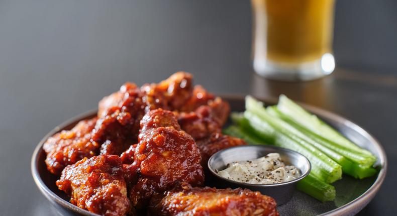 Boneless wings are typically made from strips or chunks of chicken breast meat, which are breaded and fried.Rez-art/Getty Images